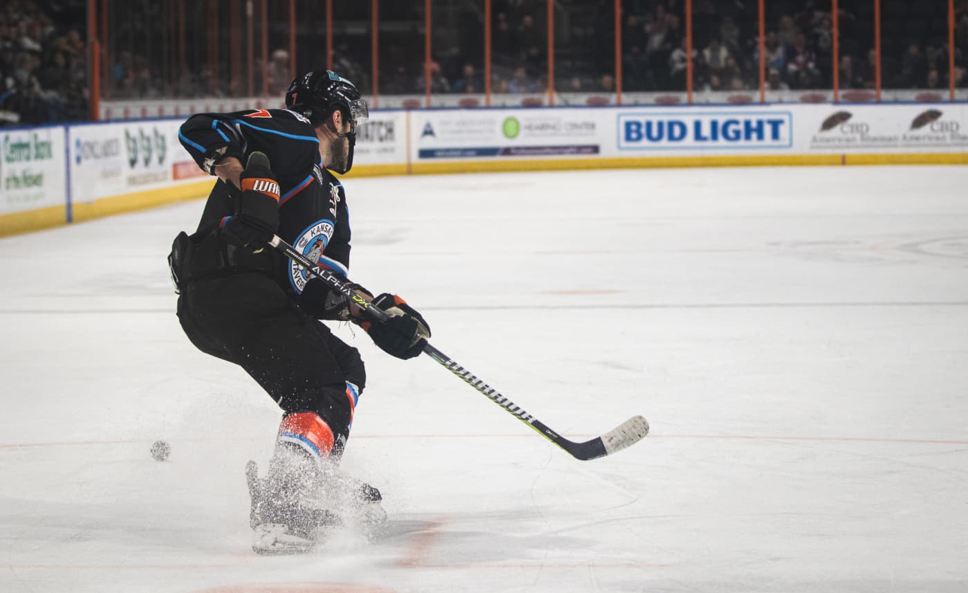 Hockey player spraying ice